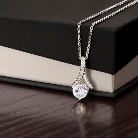 Silver Alluring Beauty necklace close-up on two-tone gift box